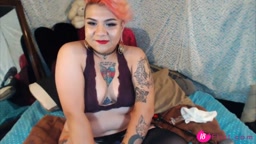 Horny 19 latina Eryyn with inked body plays with dildo